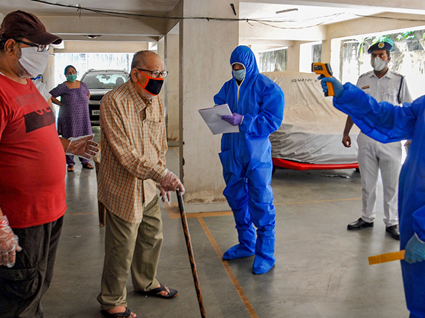 Thermal screening of residents of Mudiali area being conducted after it was sealed following the detection of Covid-19 positive case. Photo: PTI
