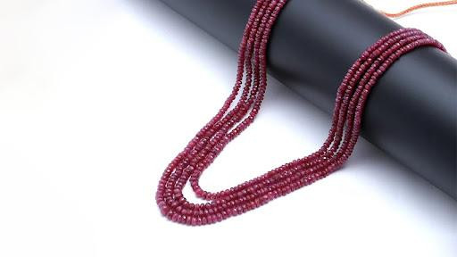 A ruby bead necklace with a beautiful background
