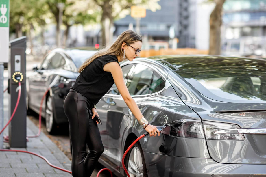 electriccarspowergridwoman.jpg