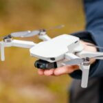 mavicminidronequadcopterinhandmancloseuproyaltyfreeimage1636406432150x1501.jpg