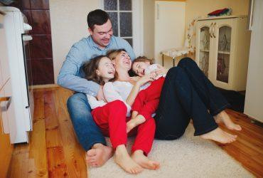 bigstock-happy-family-at-home-on-the-fl-98725220-370x250.jpg